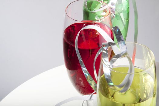 Colorful cocktails for a party decorated with silver streamers