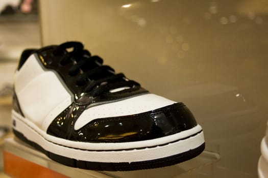 Image of a sports shoe on display for sale at a shop.