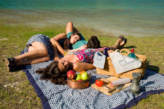 Girls resting after an ejoyable picnic outdoors