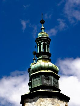 Monument tower with summer sky in background. Clouds in background too. 