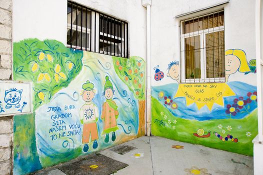 Children's drawings on walls of the house of a kindergarten, taken in Croatia