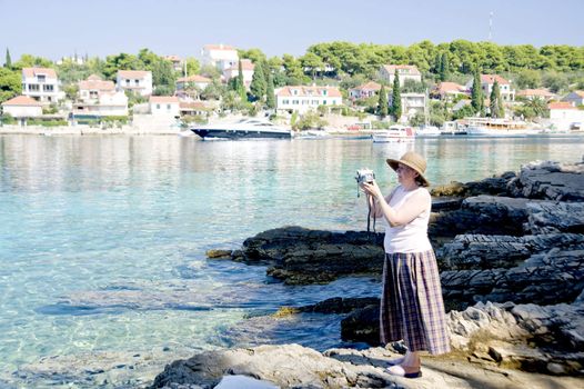 Woman take the photos on the rest time, Croatia