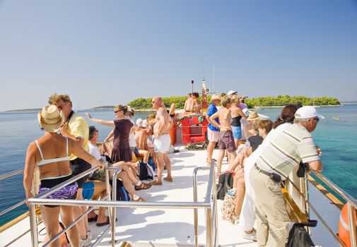 Tourists on a deck of the excursion ship, taken in Croatia 