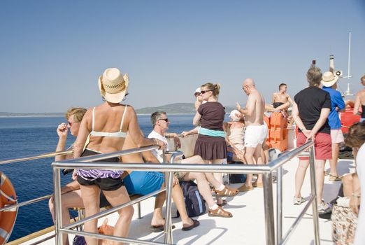Tourists on a deck of the excursion ship, taken in Croatia 