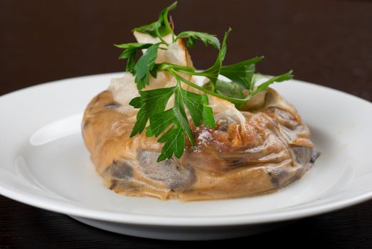 Tasty mushroom mix with cheese and cream wrapped at rice paper packet