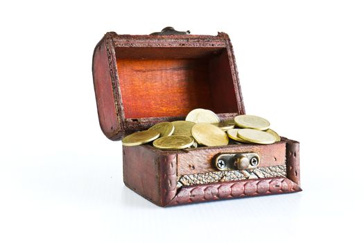 Treasure chest filled with gold coins isolated on white background