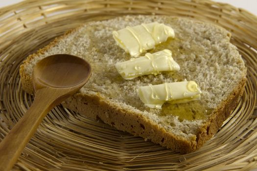 Bread slice with butter and honey