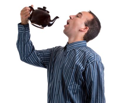 A thirsty man is about to pour tea from the kettle straight into his mouth, isolated against a white background