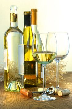 Bottles of white wine with glasses ready for wine tasting