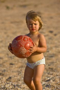 people series: little girl play on the beach with ball