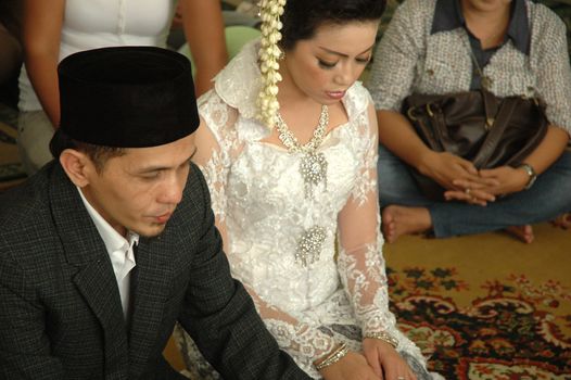 bride and groom wearing traditional costume from west java-indonesia