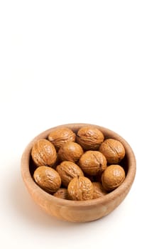 Bowl of walnuts isolated on white