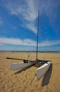 Catamaran vessel standing on a beach in Holland in summer