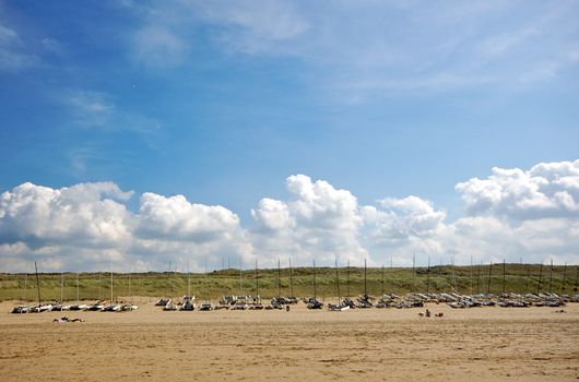 Catamaran vessels standing on a beach in Holland in summer