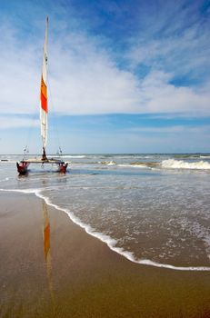 Catamaran vessel standing on a beach in Holland in summer