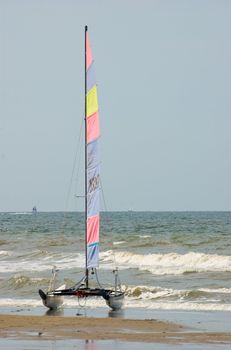 Catamaran vessel standing on a beach in Holland in summer