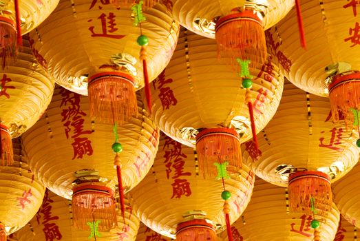Here are lot of yellow chinese lantern.