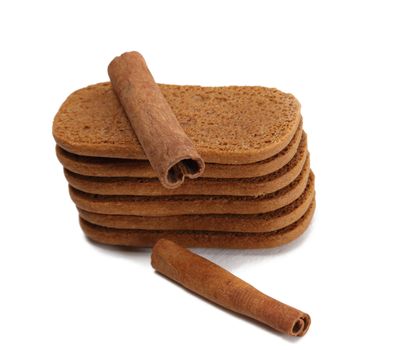 Biscuits and cinnamon against a white background.