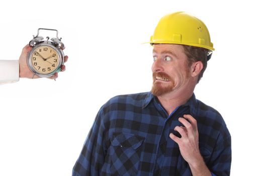 confused construction worker looking at his watch
