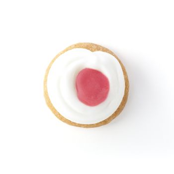 Small vanilla cookie with pink and white frosting.
