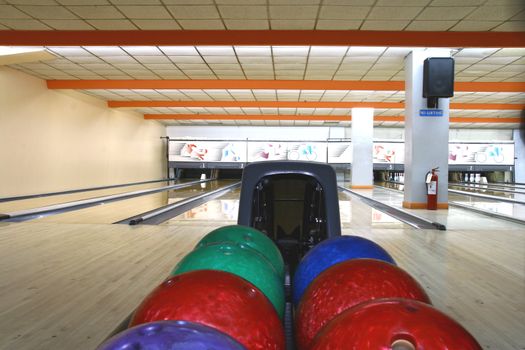 bowling balls with bowling lanes as background
