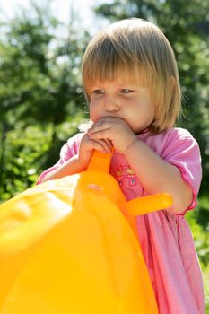 The girl inflates a ball