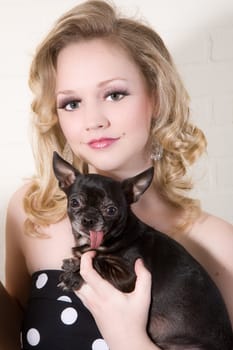 Blond beautiful woman with her little dog