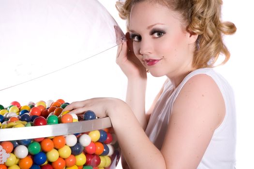 Cute blond girl with ponytails and a bowl of bubblegum balls