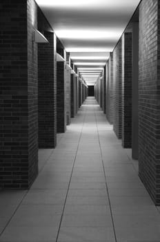 Night shot of illuminated outer corridor of a very modern apartment building.