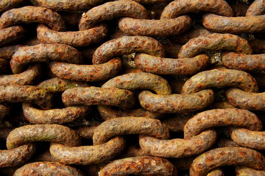 Macro of a pile of rusty iron chain. Suitable for abstract background.