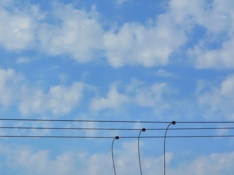 wires against blue sky