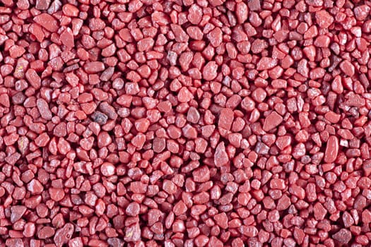 Red aquarium stones background or texture