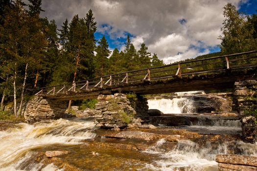 Old bridge crossing river