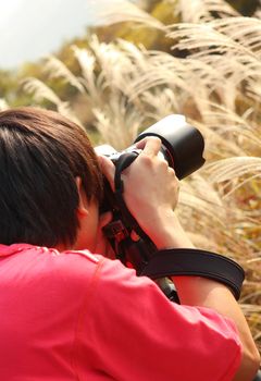 photographer taking photo in country side 