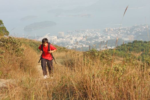 Sport hiking in mountains, walking and backpacking , the man in motion blur