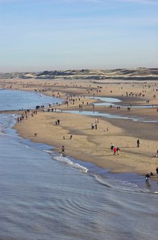 People gathering at the beach in Scheveningen in early spring