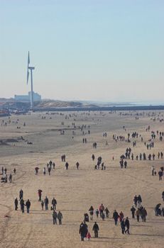 People gathering at the beach in Scheveningen in early spring