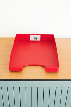 Internal mail trays on a cupboard in an office