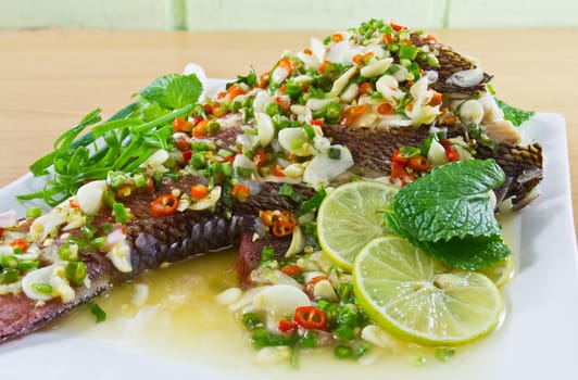 Spicy steamed fish fillet with chopped chillis healthy food