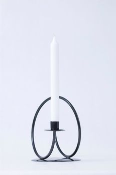 Black steel wound candleholder in simple, modern style