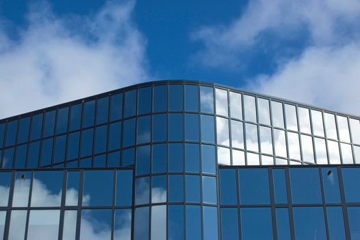 Detail of an office building facade with blue windows