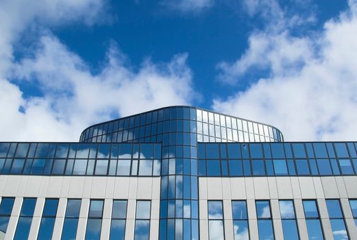 Detail of an office building facade with blue windows