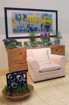 Living room arranged with modern furniture and flowers