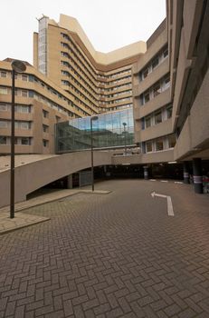 Parking lot under an office building, parking way with a directing arrow