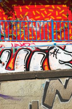 Grafitti on a wall of a pedestrian bridge crossing