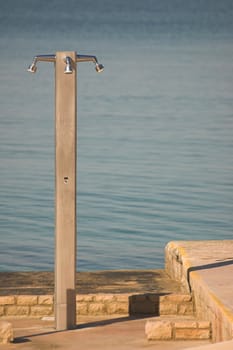 External shower appliance at the edge of a sea