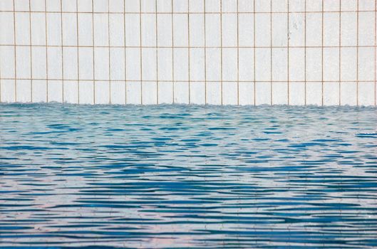 Detail of a white tiled swimming pool