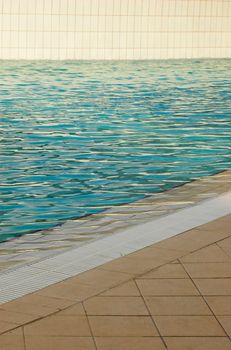 Detail of a white tiled swimming pool