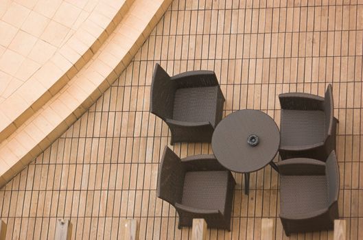 a set of chairs and a table on a terrace