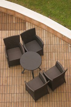 a set of chairs and a table on a terrace